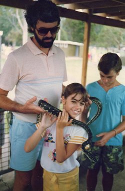 Dad helping me wrangle a snake at the Australian Reptile Park